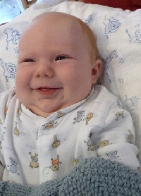 When do babies smile and what does it really mean