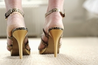 Keep high heels on by adjusting size straps and using orthotics