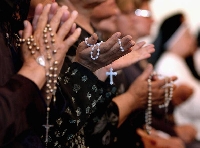 Catholics learn how to say the rosary as part of their religious training