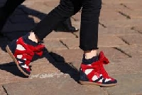 Knowing how to wear wedge sneakers gives your fashion a kick