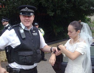 Taken away in cuffs from the ceremony is a wedding mishap