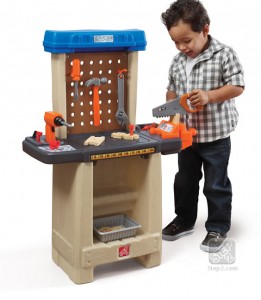 child with pretend wokshop