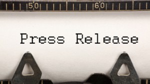 words press release on typewriter