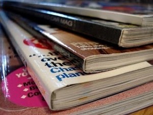 corner of pile of magazines and catalogs
