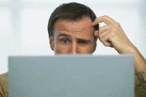 man confused at computer