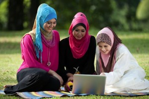 muslim young women on computer