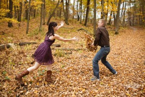 playing with autumn leaves