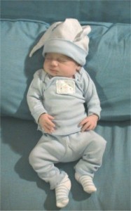 newborn in blue outfit