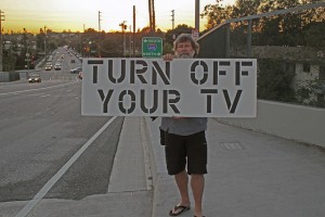 man with turn off tv sign