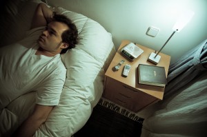 man waking up in bed