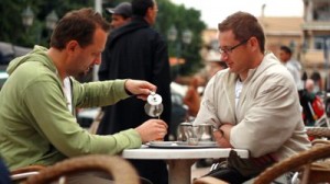 two men talking at coffee shop