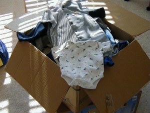 box of baby clothes