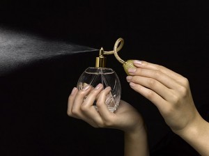 hand with perfume bottle 