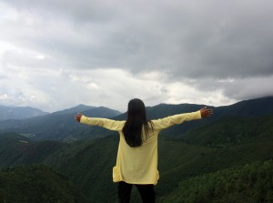 woman standing in hills