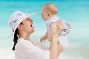 baby and mom smiling