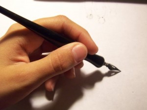 hand with fountain pen