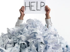 person buried under paper