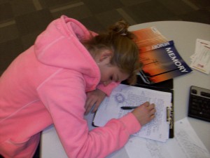 girl sleeping on school books