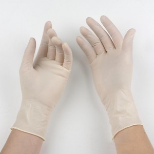 white surgical gloves on hands