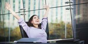 happy woman at desk
