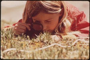 girl with magnifying glass