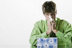 man blowing nose