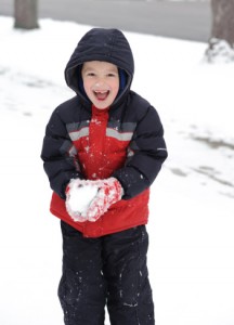 boy playing in snow