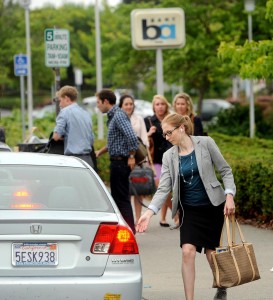 woman getting into a car