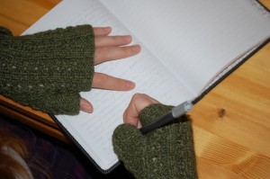 person writing in journal
