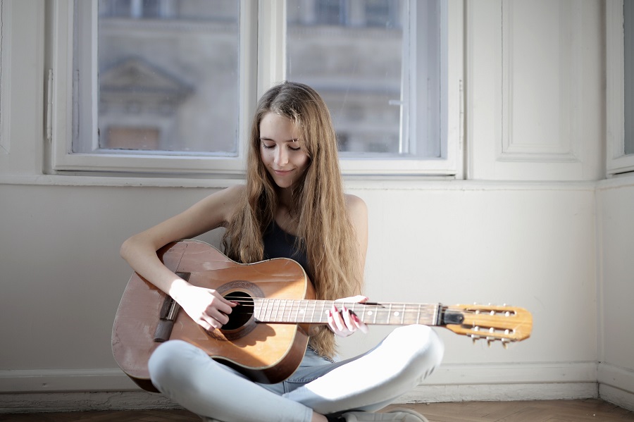 Girl playing the guitar