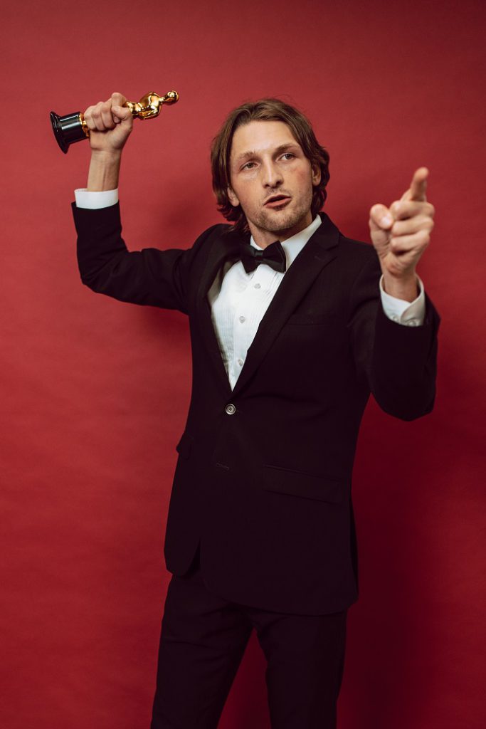 Man holding a trophy