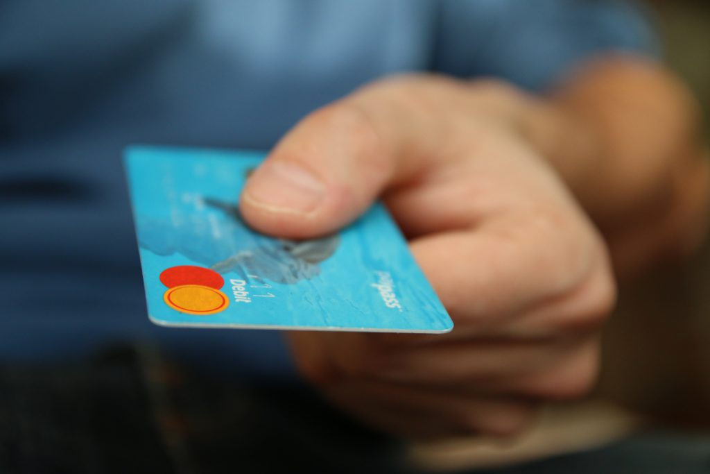 children using debit card to make payment